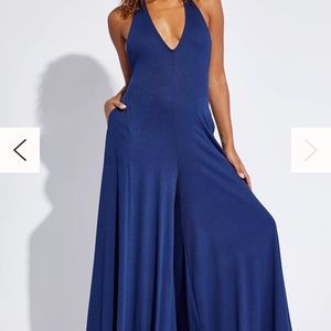 Teal free people jumpsuit, size M